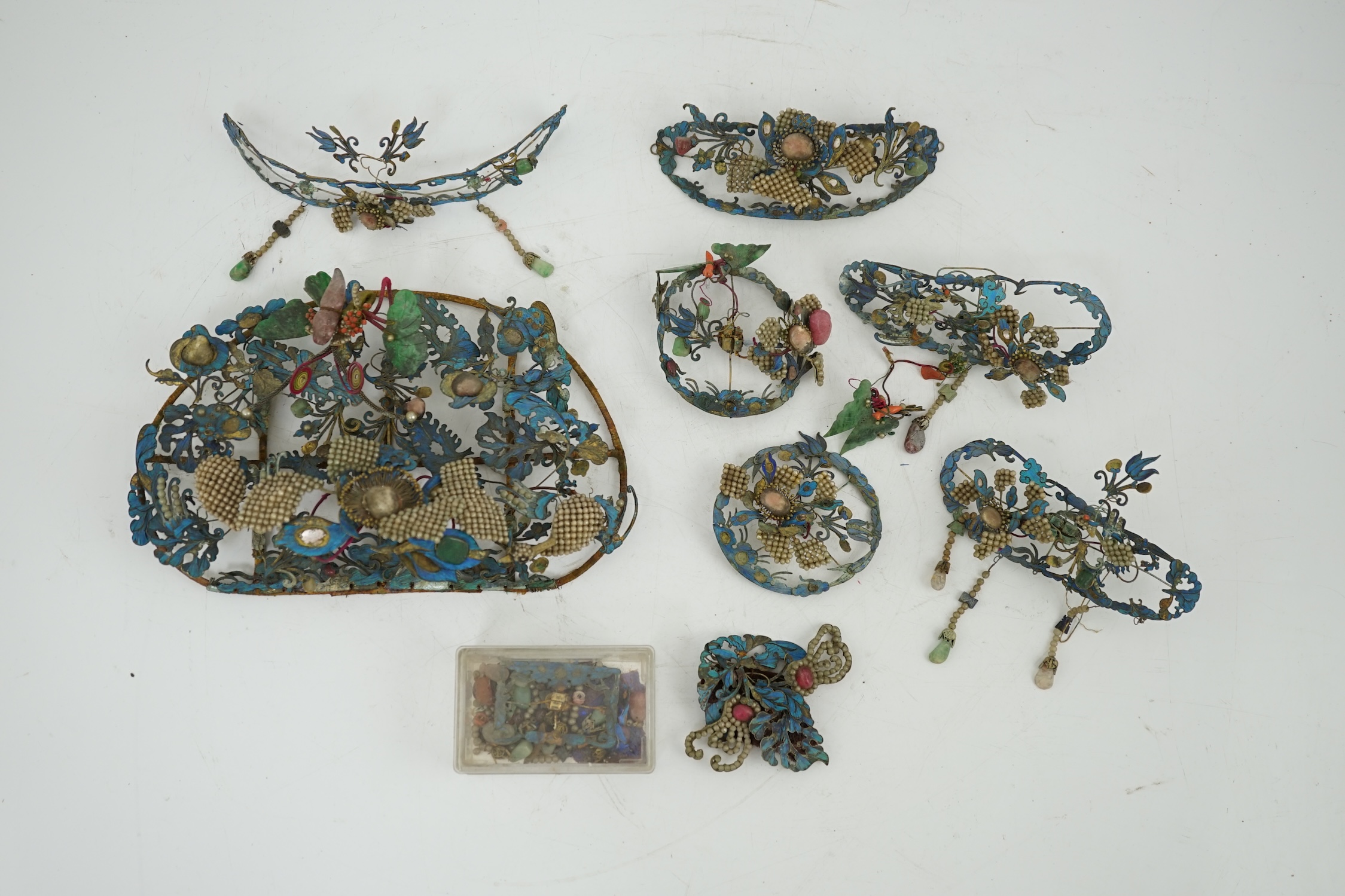A group of eight Chinese kingfisher feather, jade, seed pearl, coral and hardstone mounted headdresses and ornaments, late Qing dynasty, some losses